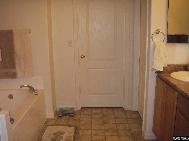10898 Dancing Aspen Drive Reno, NV 89521 - Photo 6 of 6 a bathroom with a sink and a mirror