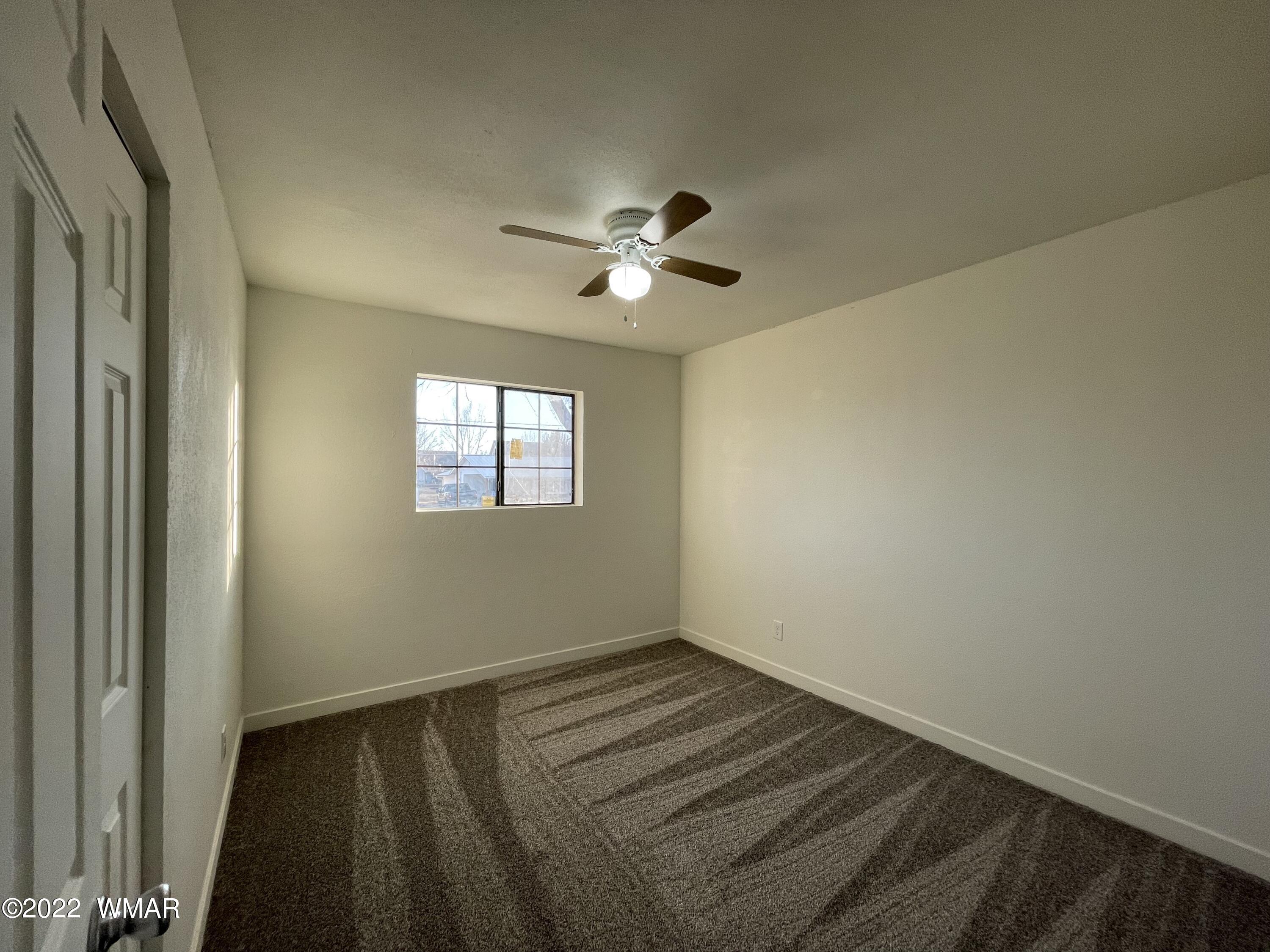 118 East 9th S Street Snowflake, AZ 85937 - Photo 12 of 19 a view of room with a ceiling fan and window