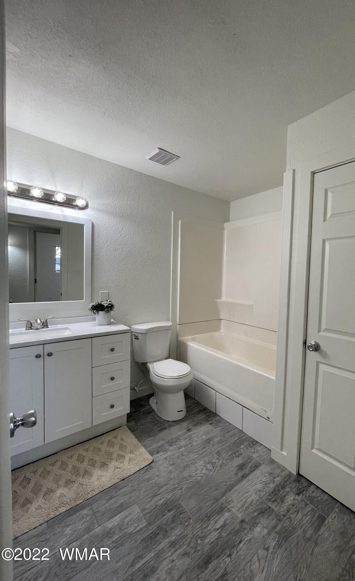 118 East 9th S Street Snowflake, AZ 85937 - Photo 14 of 19 a bathroom with a sink mirror and a toilet
