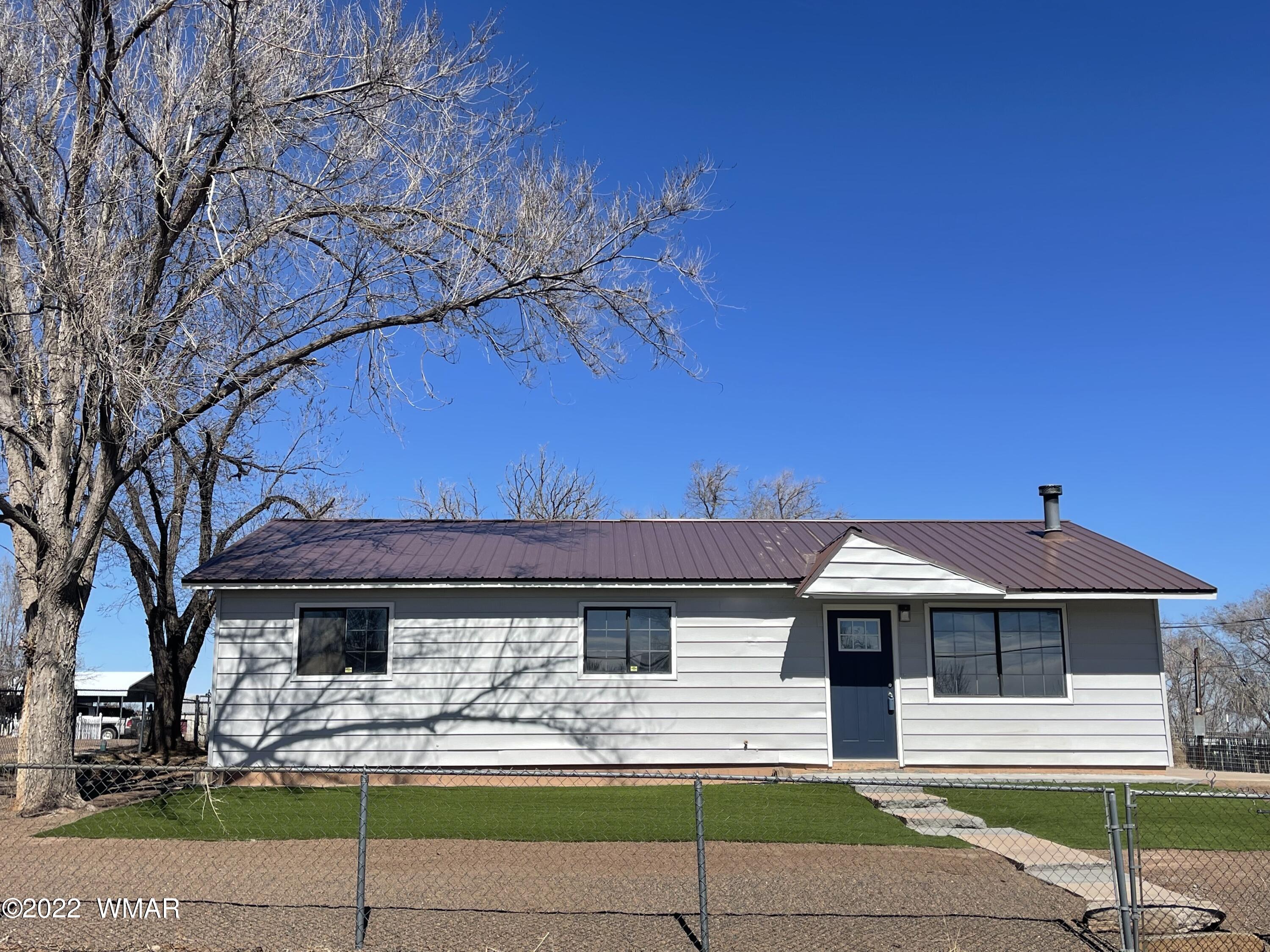 118 East 9th S Street Snowflake, AZ 85937 - Photo 16 of 19 a front view of a house with garden