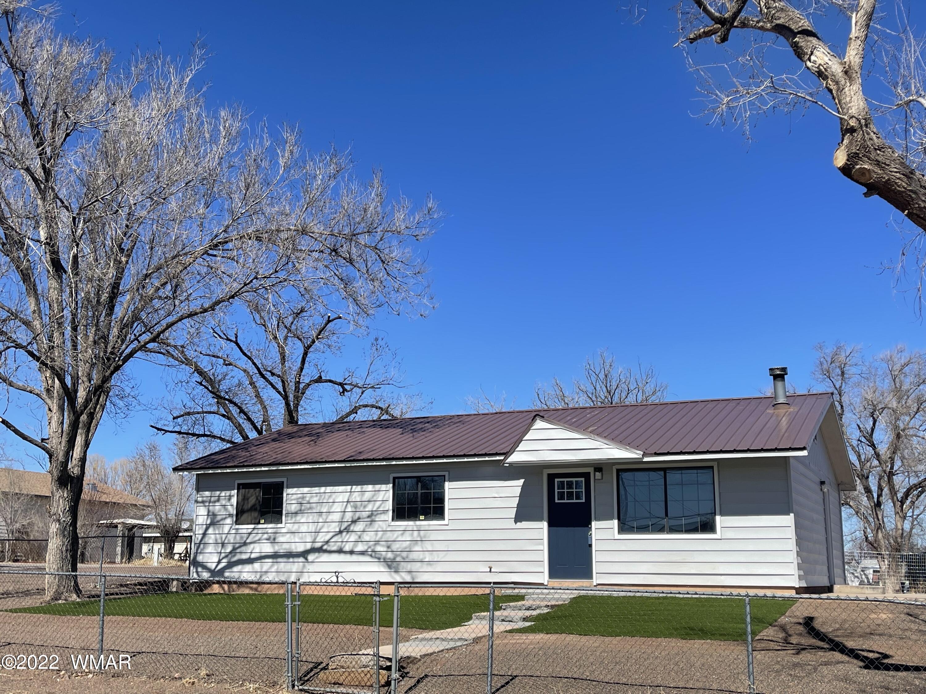 118 East 9th S Street Snowflake, AZ 85937 - Photo 17 of 19 a front view of a house with garden