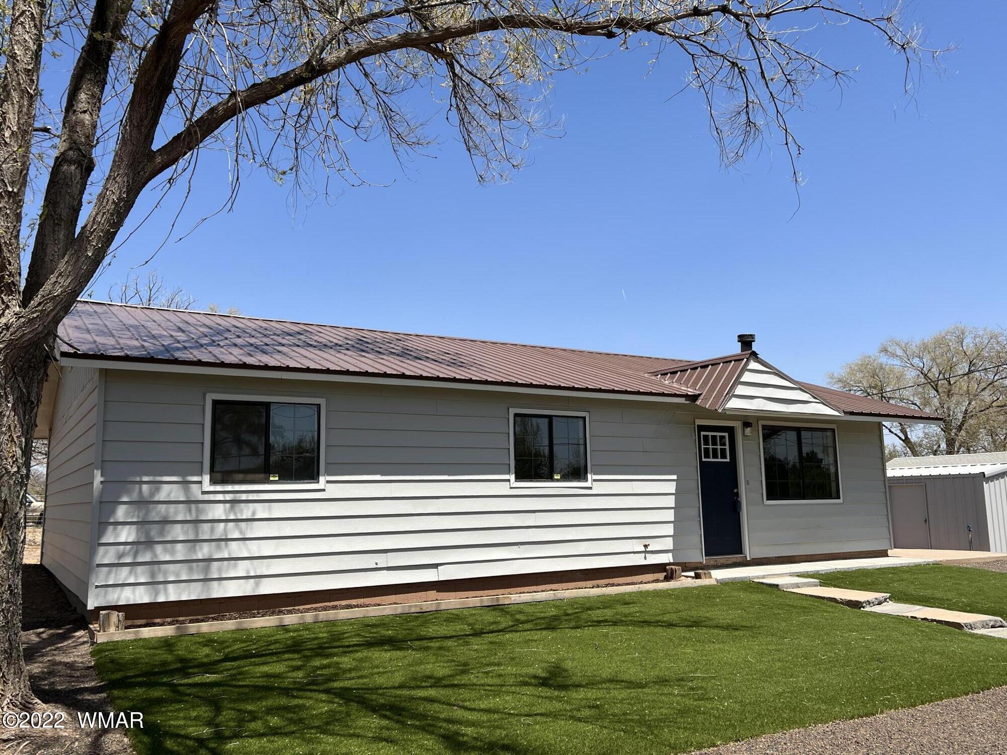 118 East 9th S Street Snowflake, AZ 85937 - Photo 2 of 19 a front view of a house with a yard
