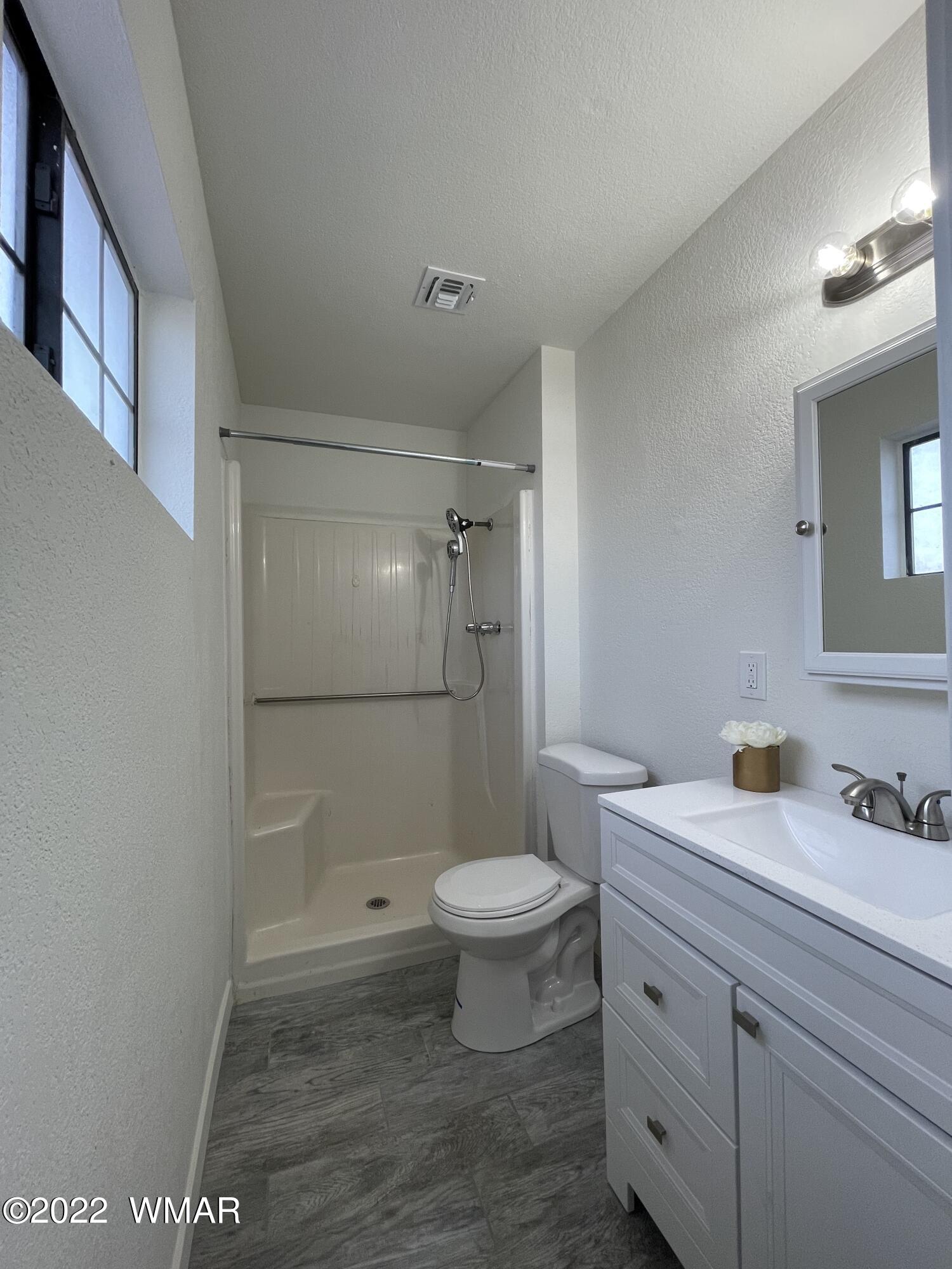 118 East 9th S Street Snowflake, AZ 85937 - Photo 10 of 19 a bathroom with a sink a toilet and shower