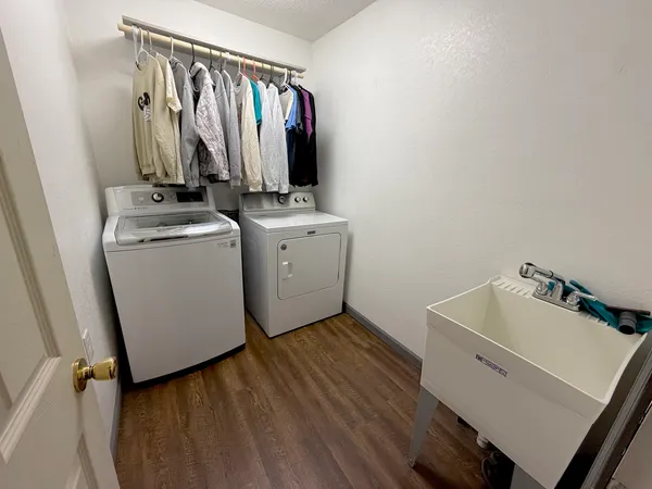 a view of storage and utility room with washer and dryer