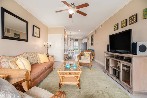 a living room with furniture and a flat screen tv