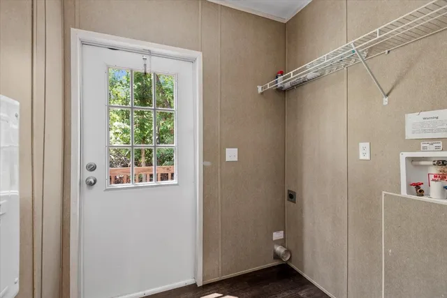 a view of an entryway with wooden floor