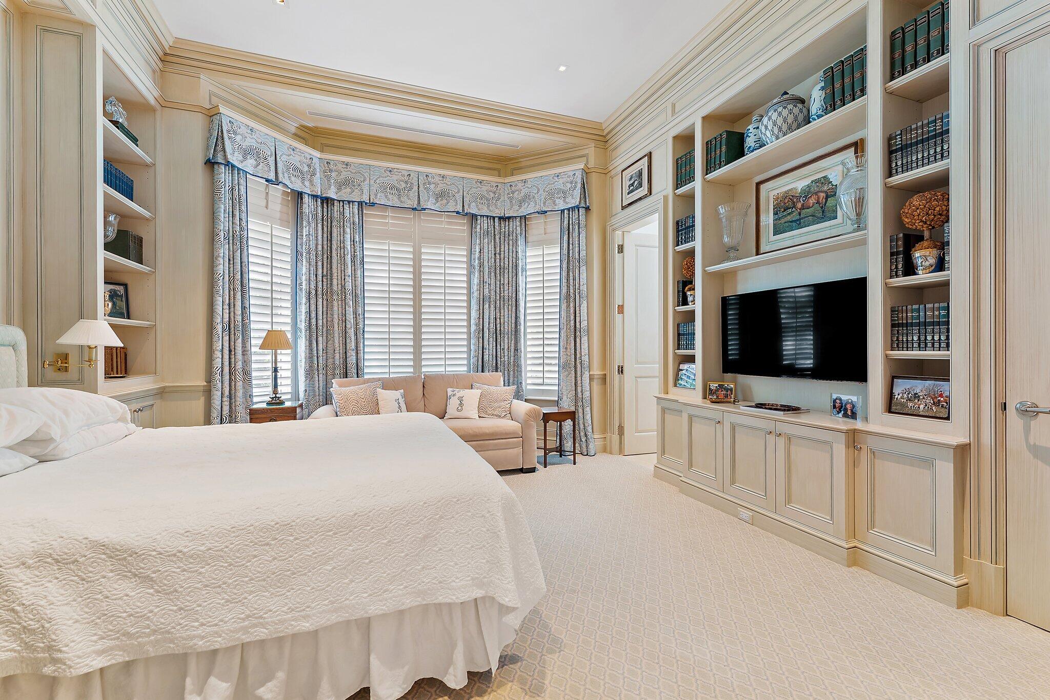 124 Bears Club Drive Jupiter, FL 33477 - Photo 12 of 67 a bedroom with a large bed and a flat screen tv