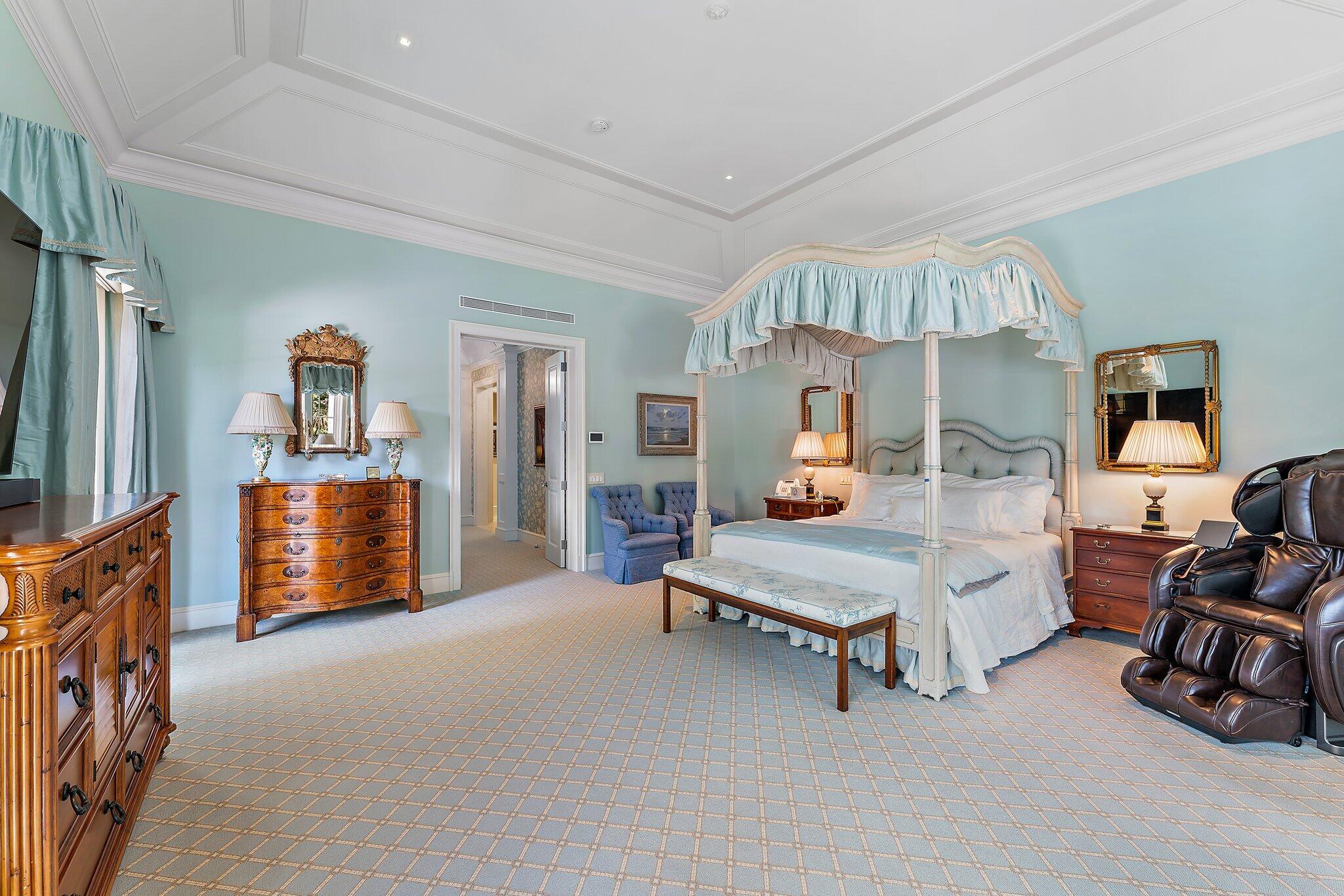 124 Bears Club Drive Jupiter, FL 33477 - Photo 22 of 67 a bedroom with furniture and a flat tv screen