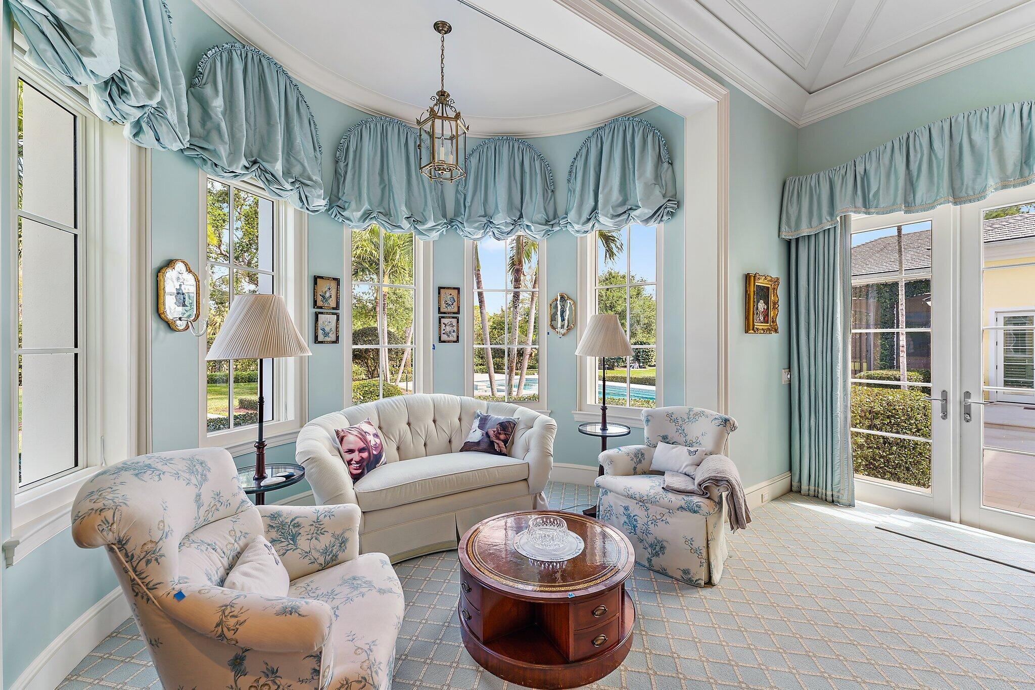 124 Bears Club Drive Jupiter, FL 33477 - Photo 24 of 67 a living room with furniture and a large window