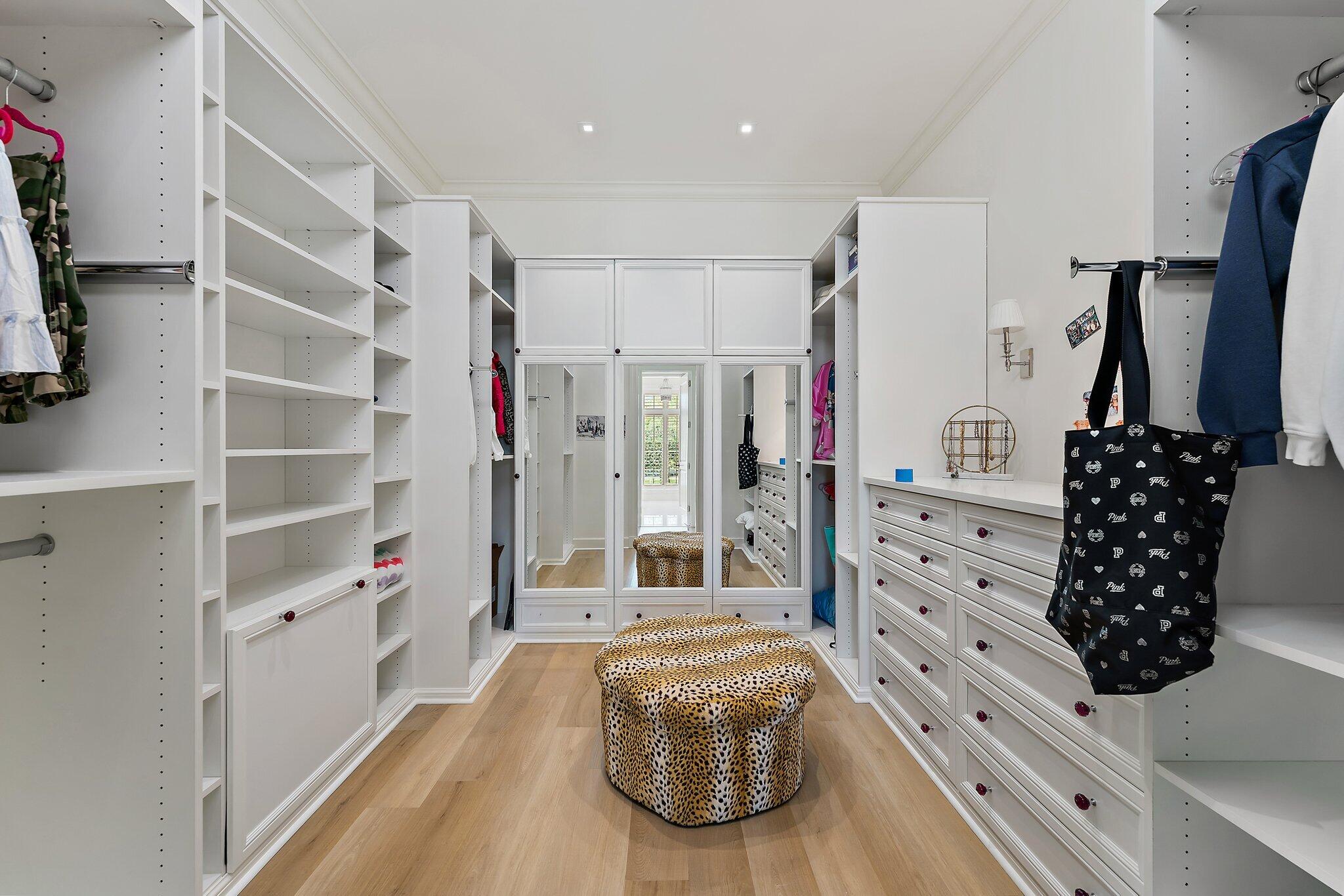 124 Bears Club Drive Jupiter, FL 33477 - Photo 40 of 67 a view of walk in closet with clothes and shoes