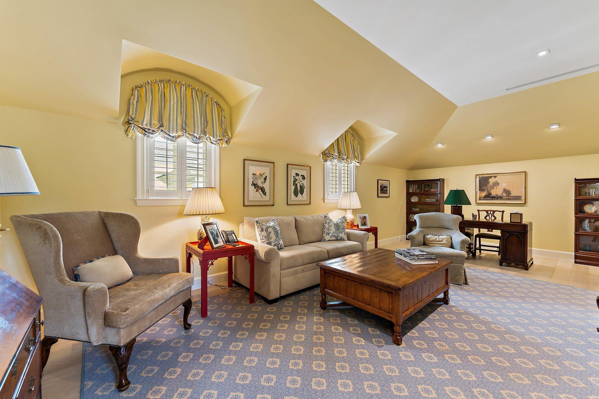 124 Bears Club Drive Jupiter, FL 33477 - Photo 48 of 67 a living room with furniture a window and a flat screen tv