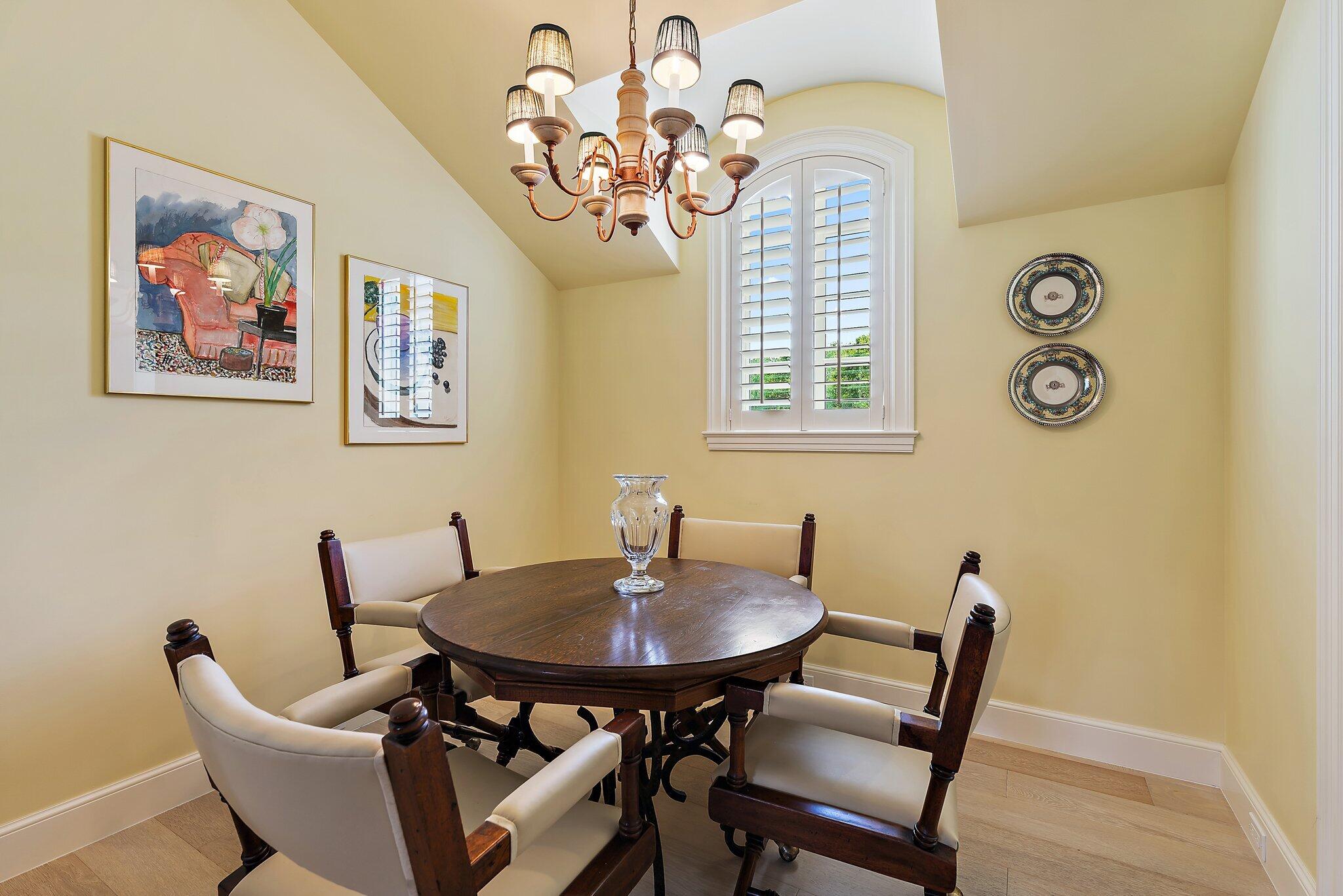 124 Bears Club Drive Jupiter, FL 33477 - Photo 49 of 67 a view of a dining room with furniture and chandelier