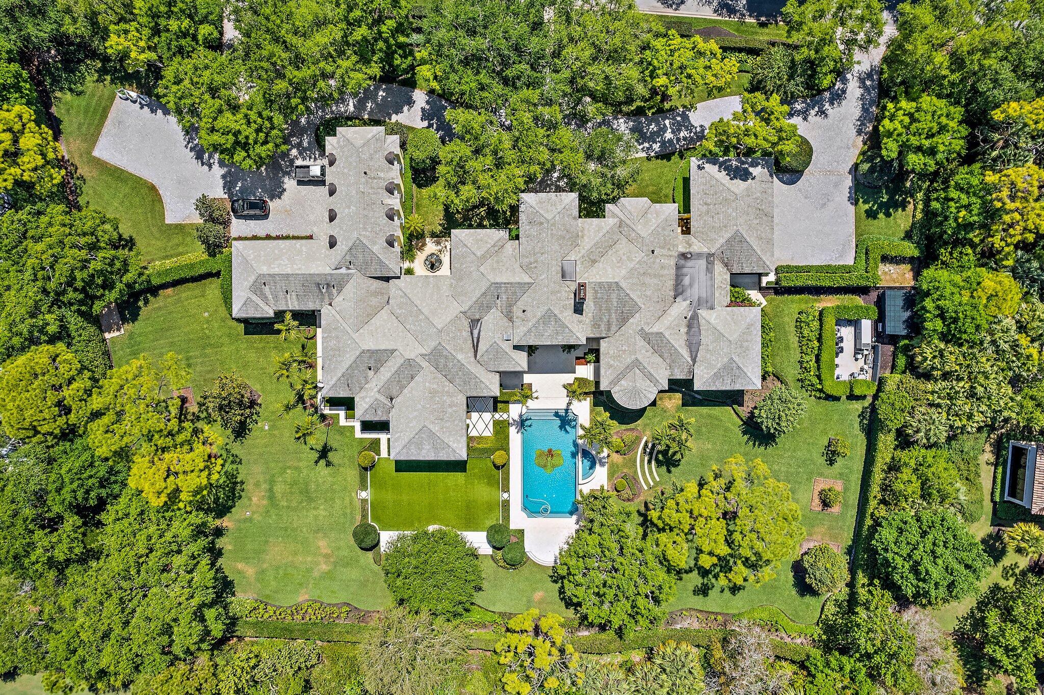 124 Bears Club Drive Jupiter, FL 33477 - Photo 5 of 67 an aerial view of residential house with outdoor space and trees all around