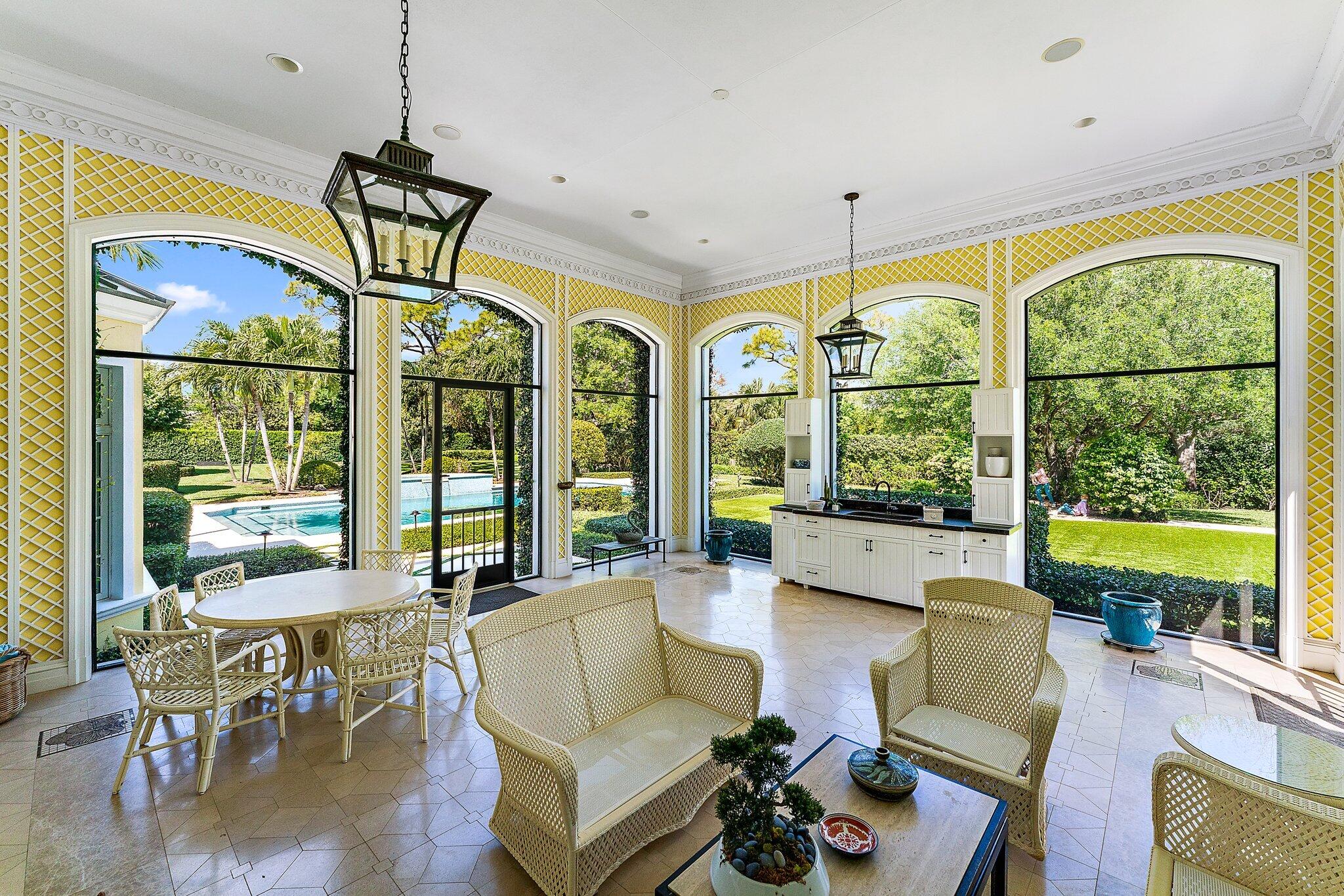 124 Bears Club Drive Jupiter, FL 33477 - Photo 54 of 67 a living room with furniture and a large window