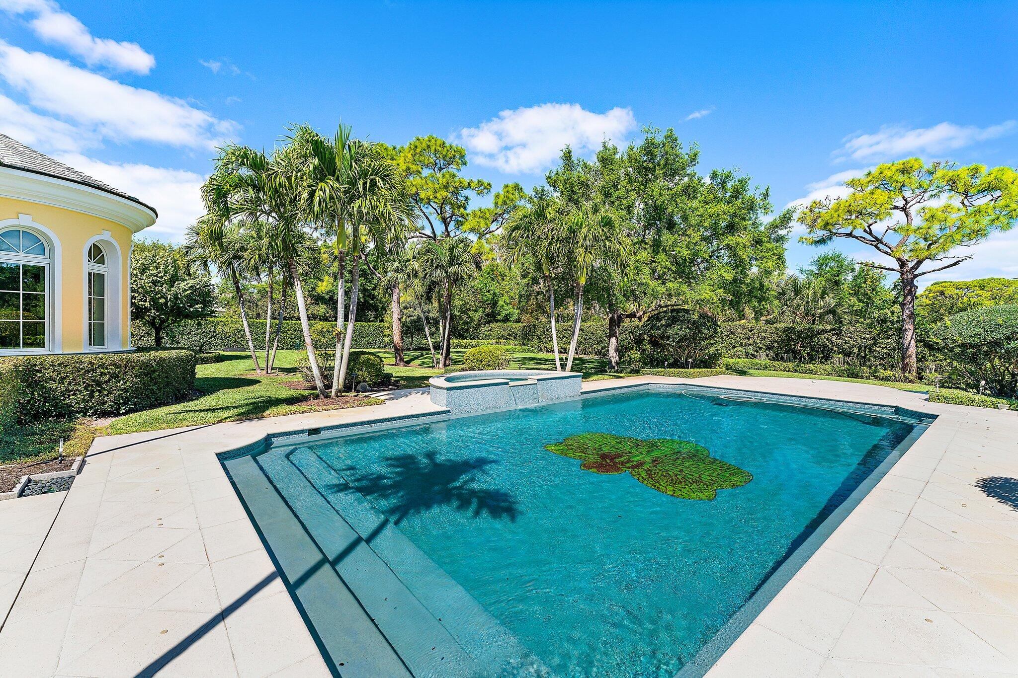 124 Bears Club Drive Jupiter, FL 33477 - Photo 58 of 67 a view of a swimming pool with a patio