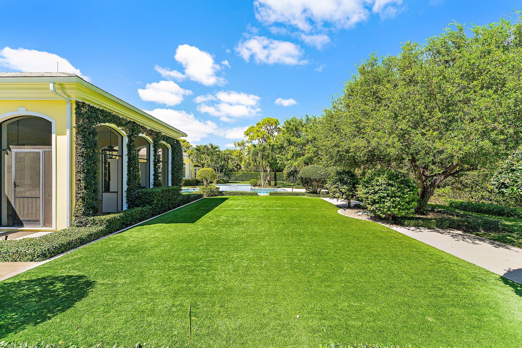 124 Bears Club Drive Jupiter, FL 33477 - Photo 62 of 67 a view of a house with a big yard