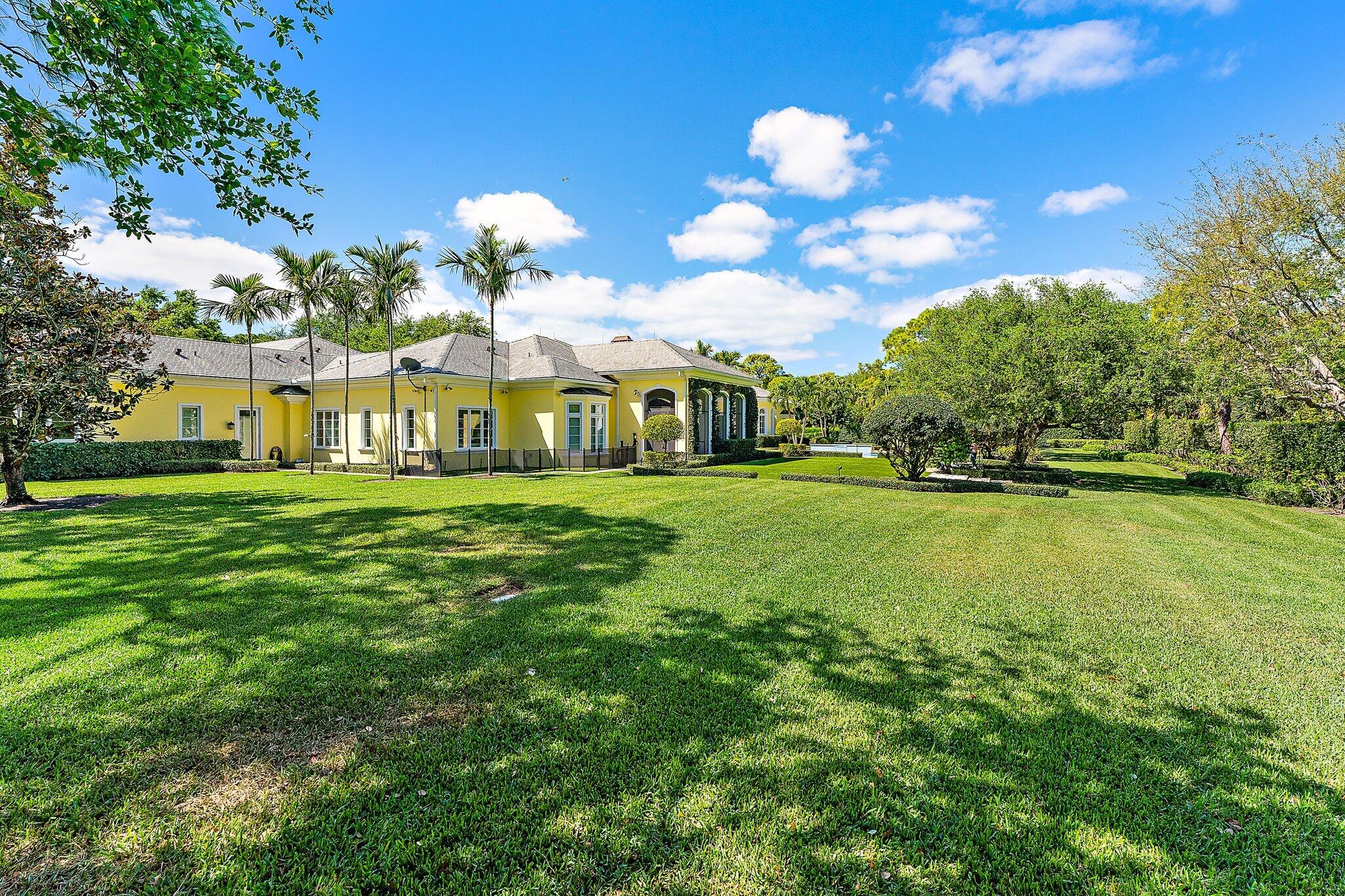 124 Bears Club Drive Jupiter, FL 33477 - Photo 63 of 67 a view of a house with a big yard