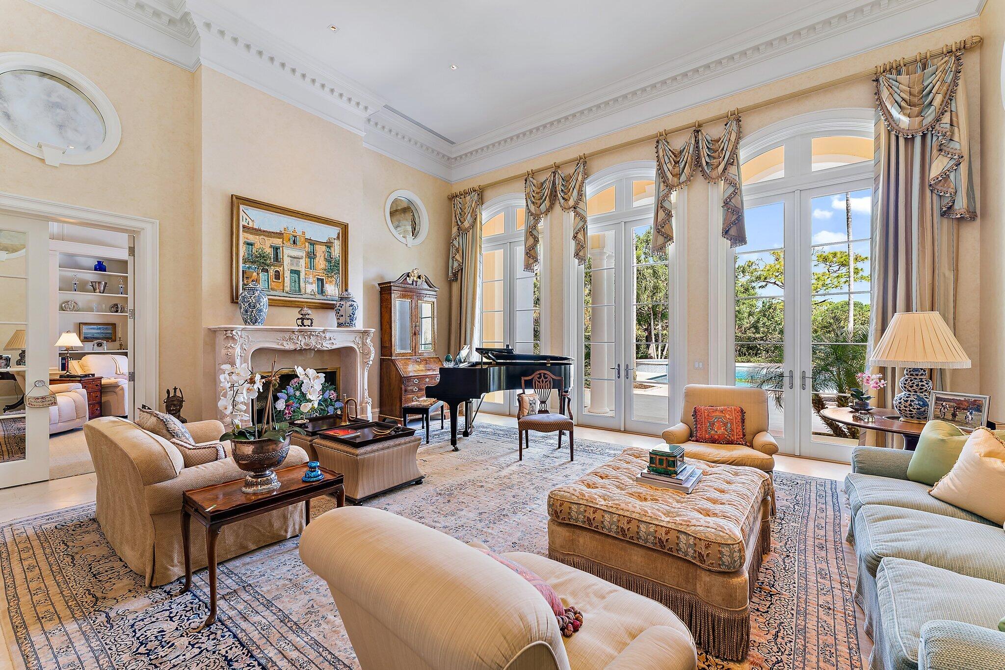 124 Bears Club Drive Jupiter, FL 33477 - Photo 8 of 67 a living room with furniture and a large window