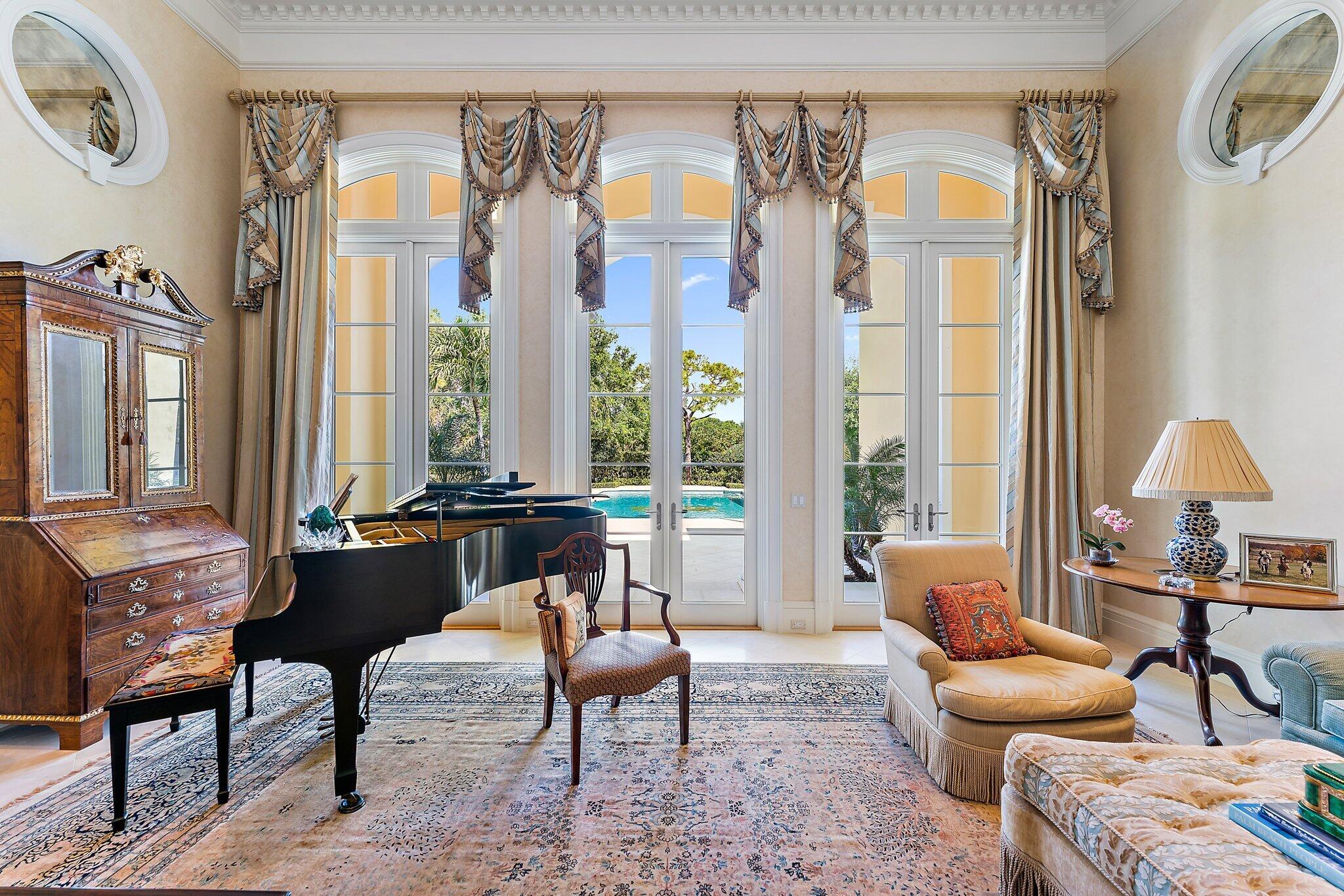 124 Bears Club Drive Jupiter, FL 33477 - Photo 10 of 67 a living room with furniture and a large window