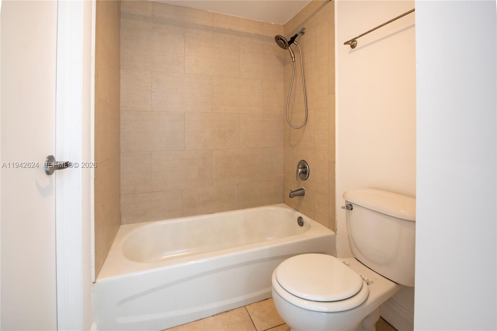 4137 Stirling Road, Unit 506 Dania Beach, FL 33314 - Photo 11 of 13 a bathroom with a toilet and a bathtub