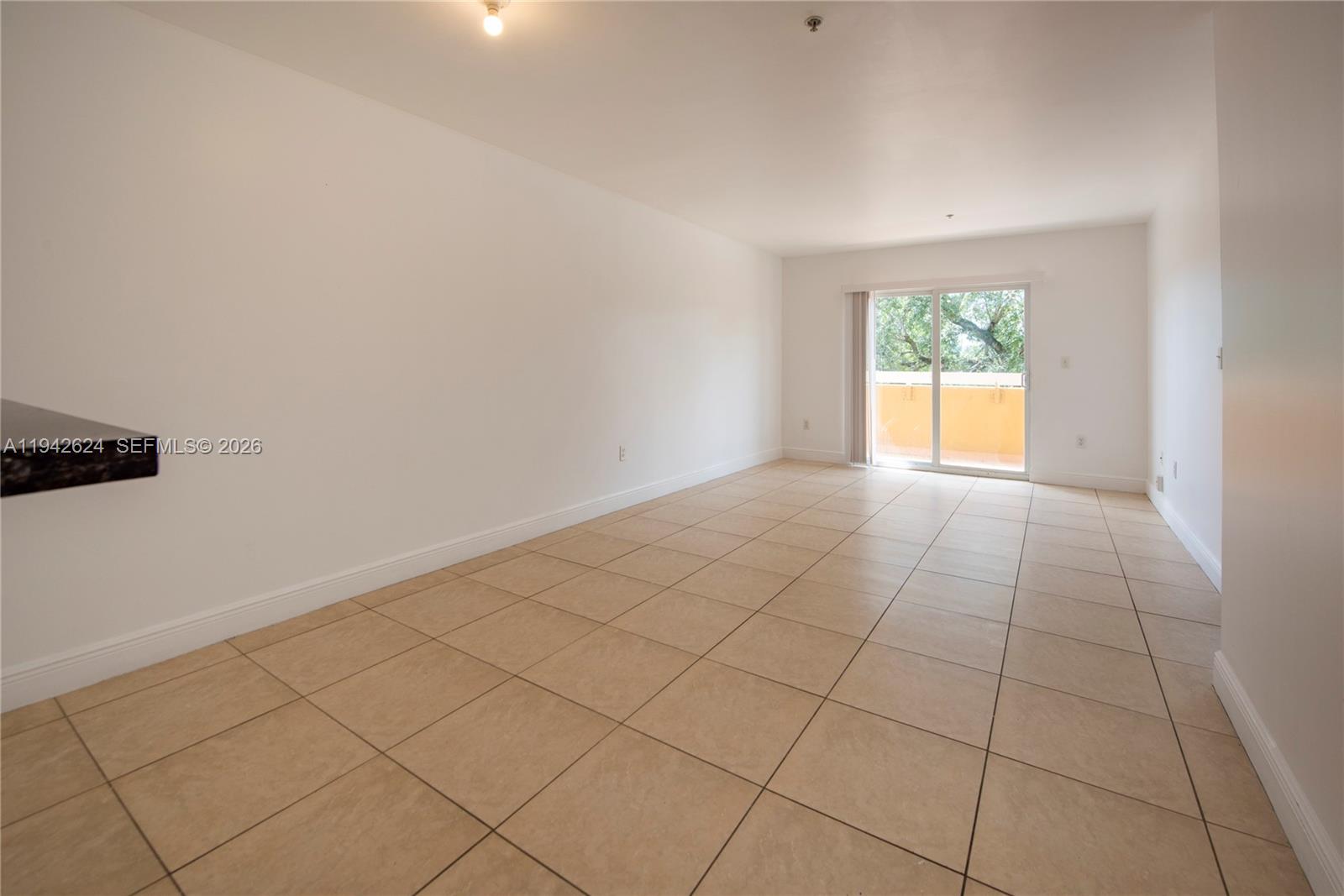 4137 Stirling Road, Unit 506 Dania Beach, FL 33314 - Photo 7 of 13 a view of an empty room and window