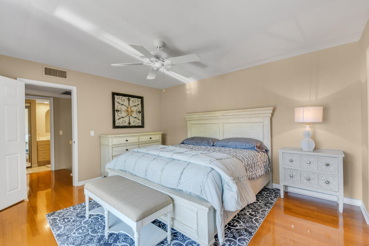 3900 County Line Road, Unit 9D Tequesta, FL 33469 - Photo 21 of 34 a bedroom with a bed and a couch