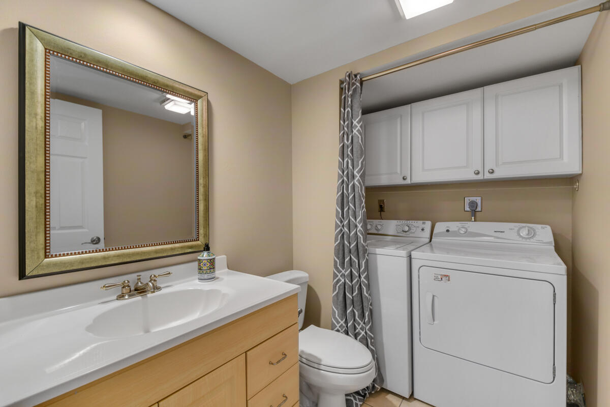 3900 County Line Road, Unit 9D Tequesta, FL 33469 - Photo 30 of 34 a view of bathroom with a sink toilet and mirror