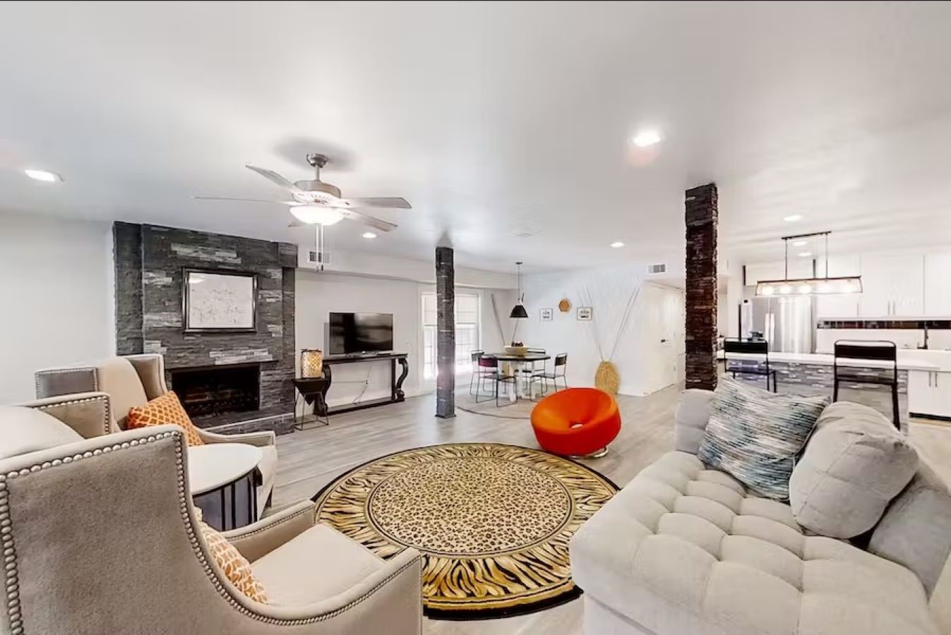 6325 Riverview Way, Unit A Houston, TX 77057 - Photo 2 of 16 Enjoy a spacious living room with a cozy fireplace, fully furnished offering both comfort and style.