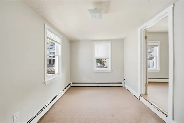a view of a hallway with a white walls