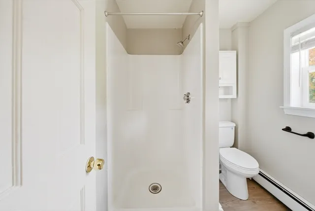 a bathroom with a sink toilet and mirror