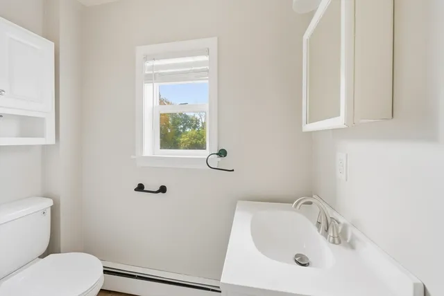 a view of a livingroom with furniture and a flat screen tv