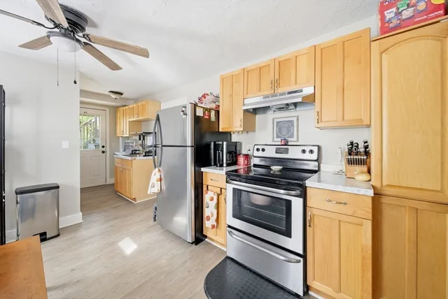 a view of a livingroom with furniture and a window