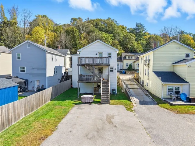 a view of balcony with wooden floor and outdoor seating