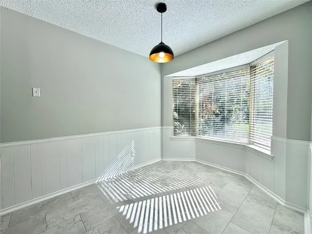 a view of a room with window and tub