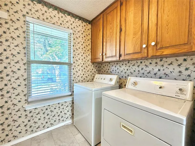 a view of bathroom with washer and dryer