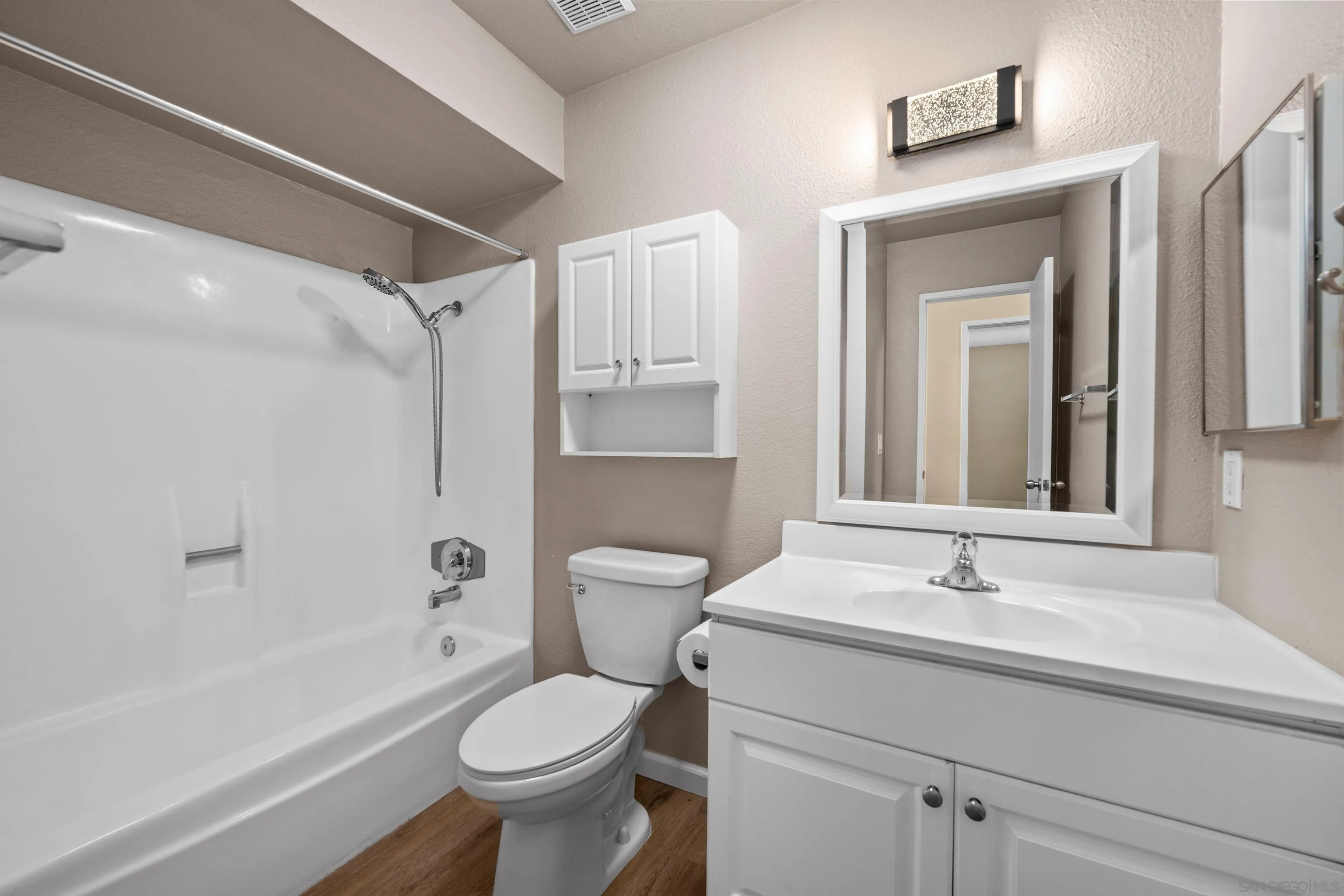 6911 Alvarado Road, Unit 20 San Diego, CA 92120 - Photo 10 of 28 a bathroom with a sink toilet and shower