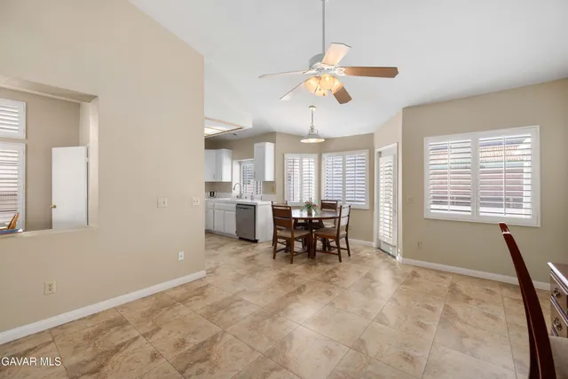 a view of dining room with furniture and window