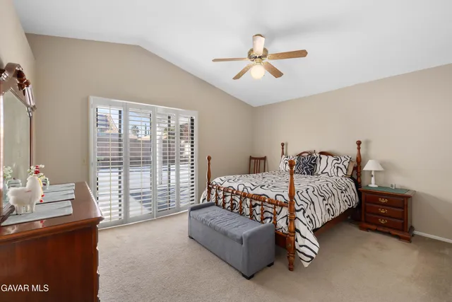 a bedroom with bed and window