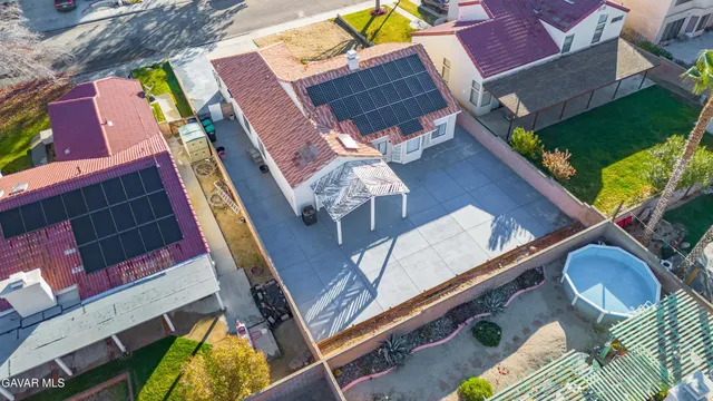 a balcony with chairs and a table