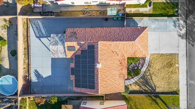 an aerial view of a house with swimming pool