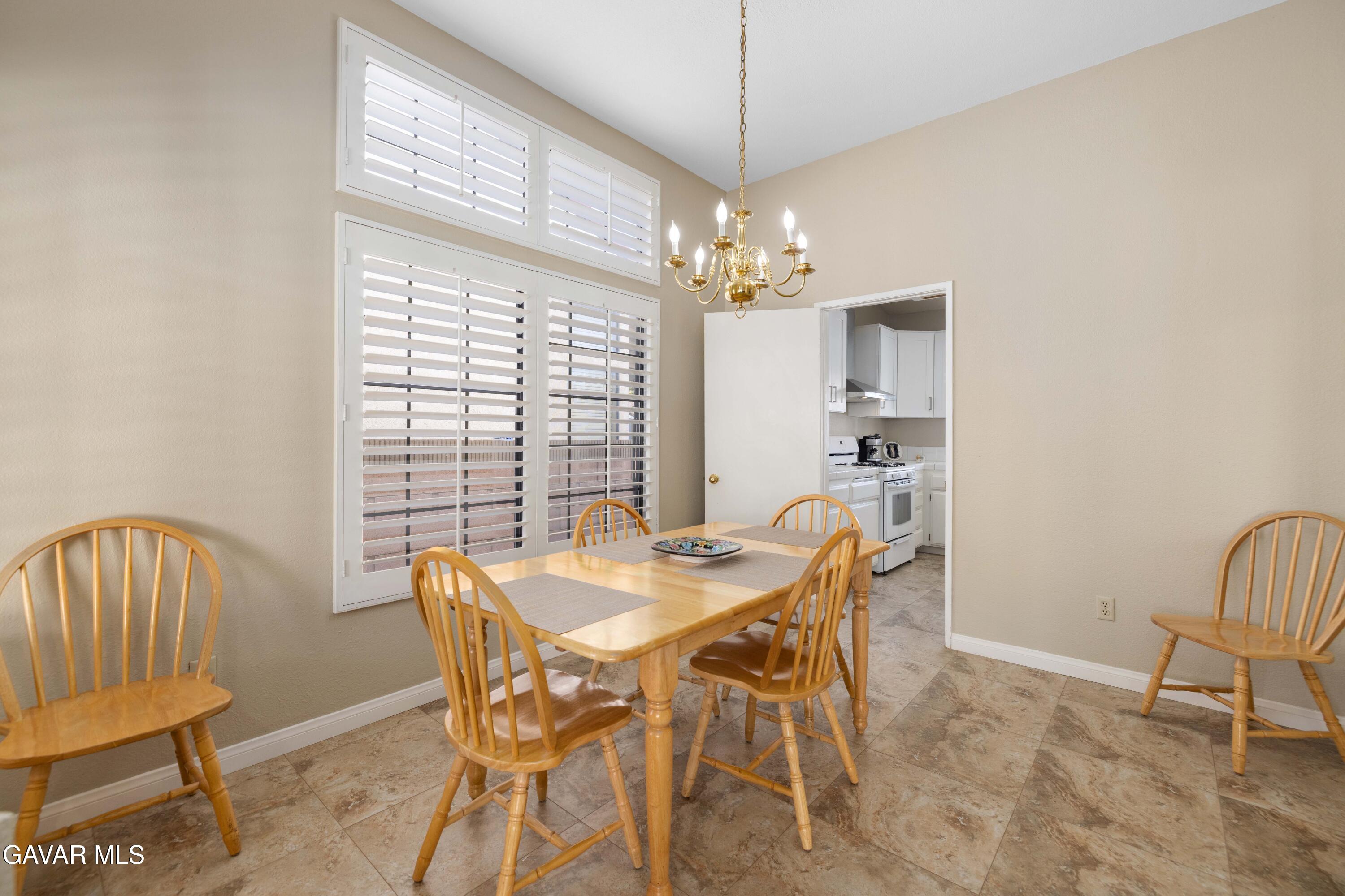 44239 Fenner Avenue Lancaster, CA 93536 - Photo 8 of 31 a view of a dining room with furniture window and outside view