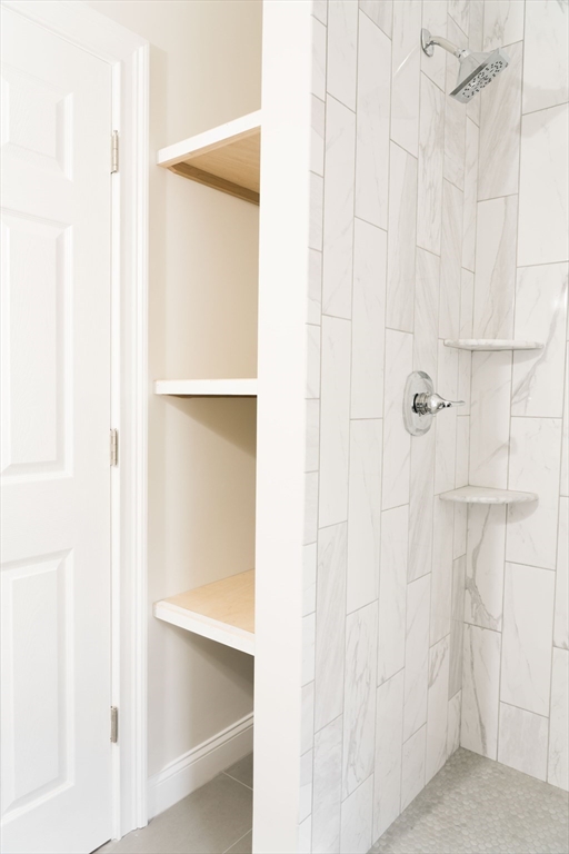 217 West 9th Street, Unit 1 Boston, MA 02127 - Photo 10 of 14 a bathroom with a glass shower door