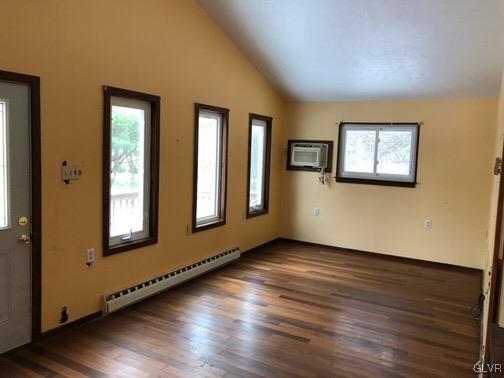 3309 Aspen Road Kunkletown, PA 18058 - Photo 4 of 13 a view of an empty room with wooden floor and a window