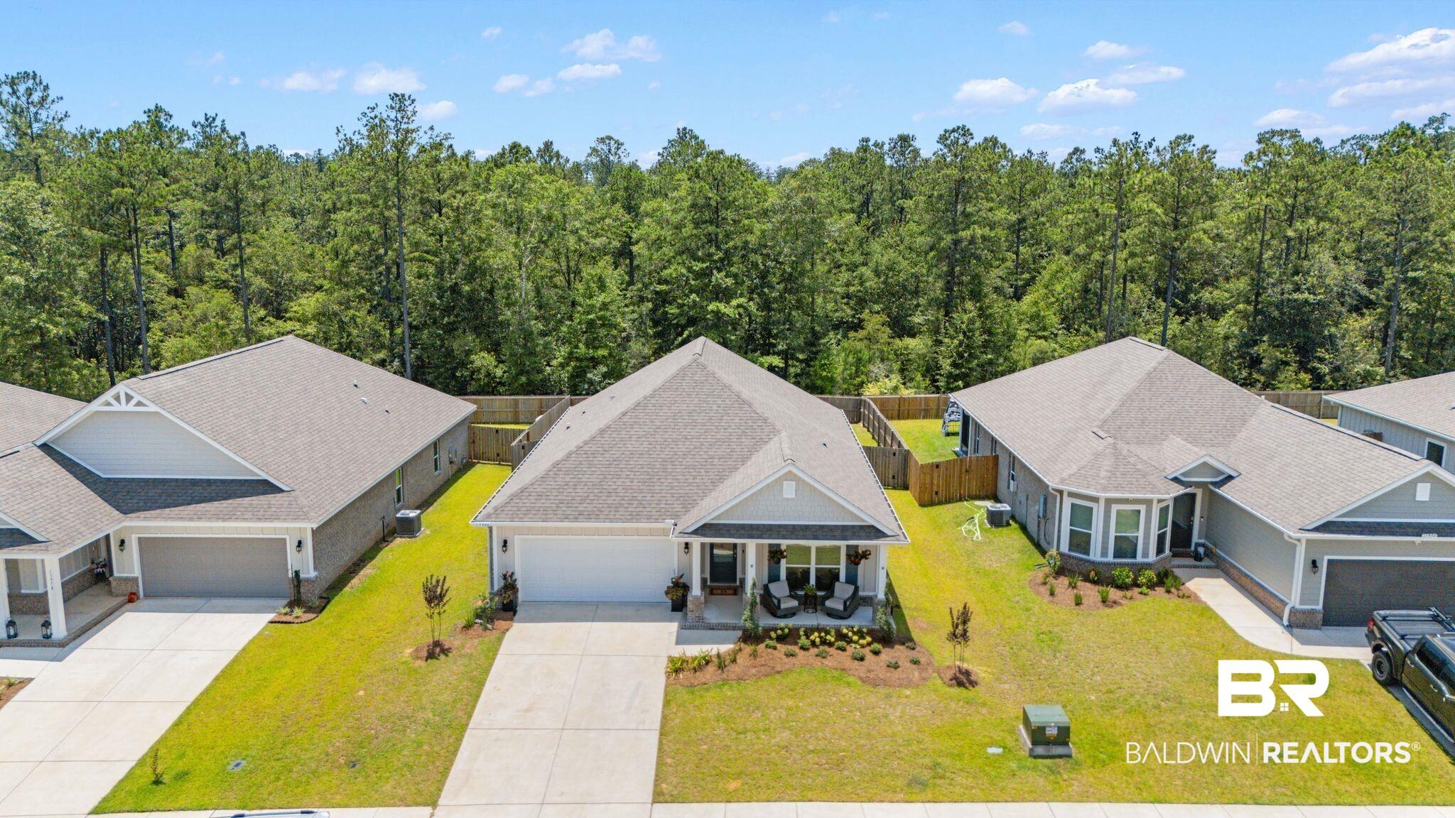 13966 Antler Hl Road Daphne, AL 36527 - Photo 35 of 44 Single-story residence featuring a covered front porch, an attached garage, and a manicured lawn