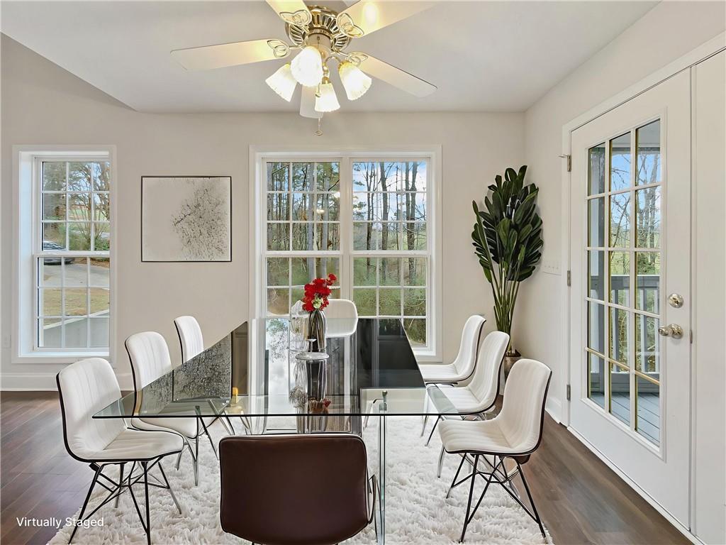 185 Thrasher Lane Jasper, GA 30143 - Photo 14 of 32 a dining room with furniture a chandelier and wooden floor