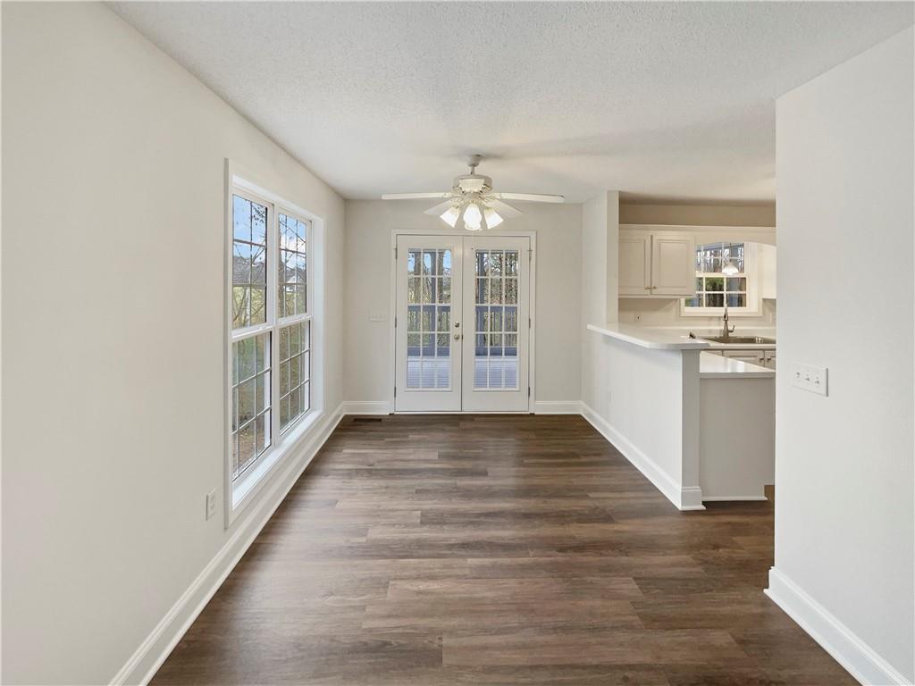185 Thrasher Lane Jasper, GA 30143 - Photo 16 of 32 wooden floor in an empty room with a window