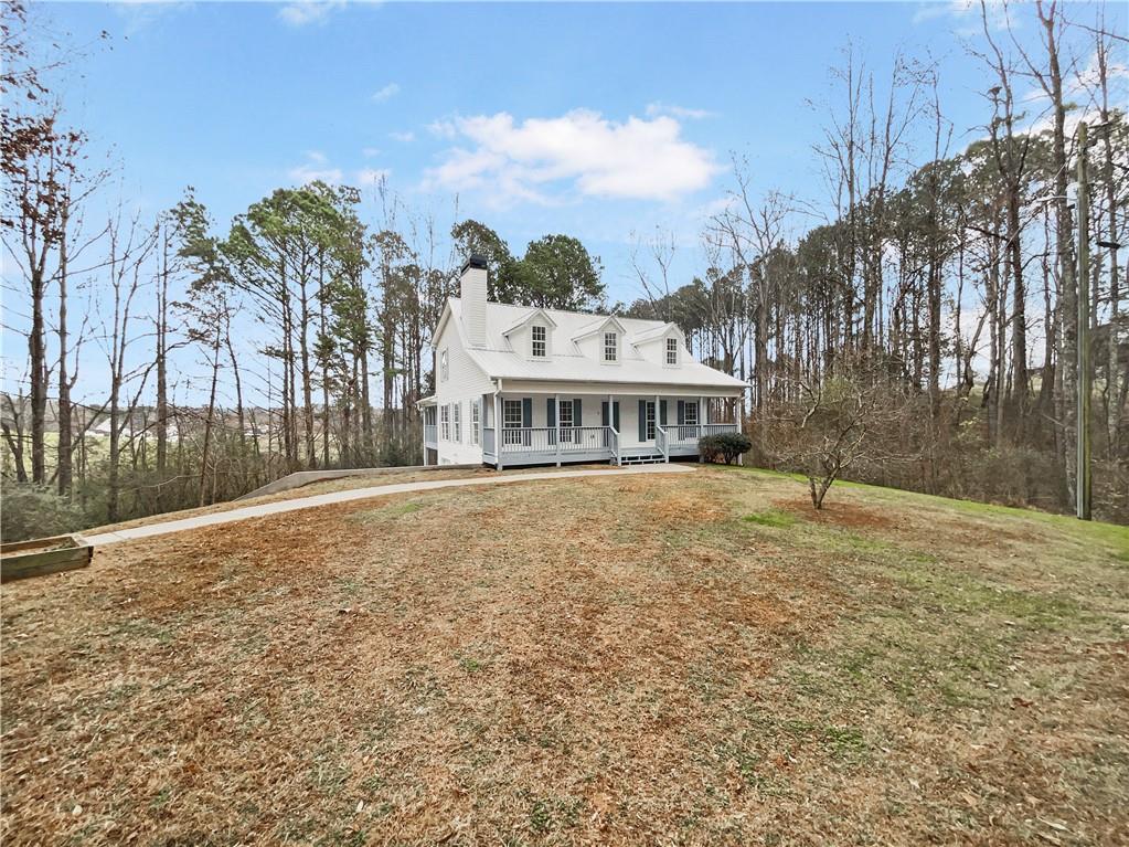 185 Thrasher Lane Jasper, GA 30143 - Photo 2 of 32 a front view of a house with a yard