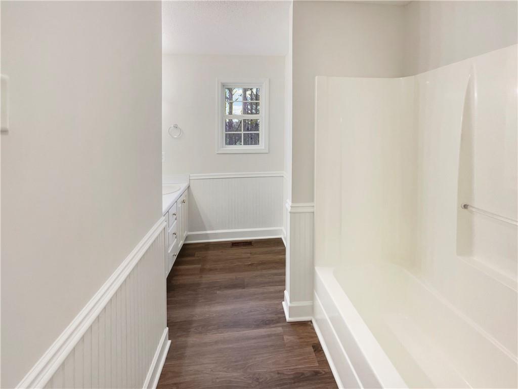 185 Thrasher Lane Jasper, GA 30143 - Photo 23 of 32 a view of a hallway with wooden floor and entryway