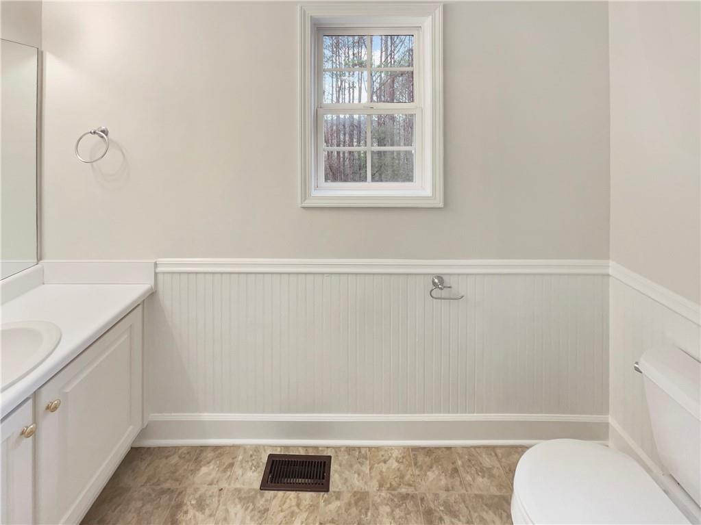 185 Thrasher Lane Jasper, GA 30143 - Photo 26 of 32 a bathroom with a sink a toilet and shower