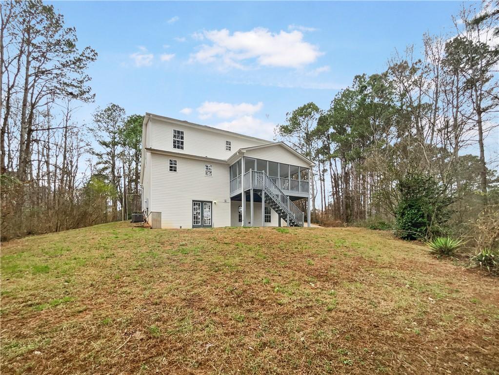 185 Thrasher Lane Jasper, GA 30143 - Photo 31 of 32 a front view of house with yard and trees around